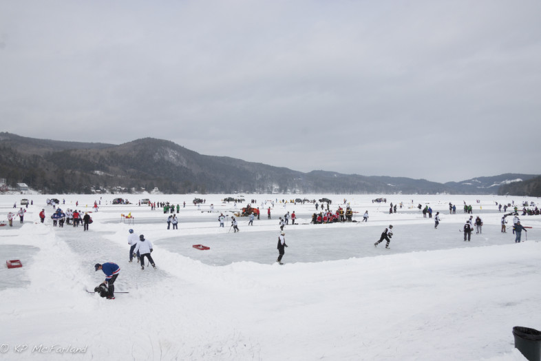 A pond hockey takes place on Lake Morey ice while VCE biologists talked about life in the cold below. / © K.P. McFarland