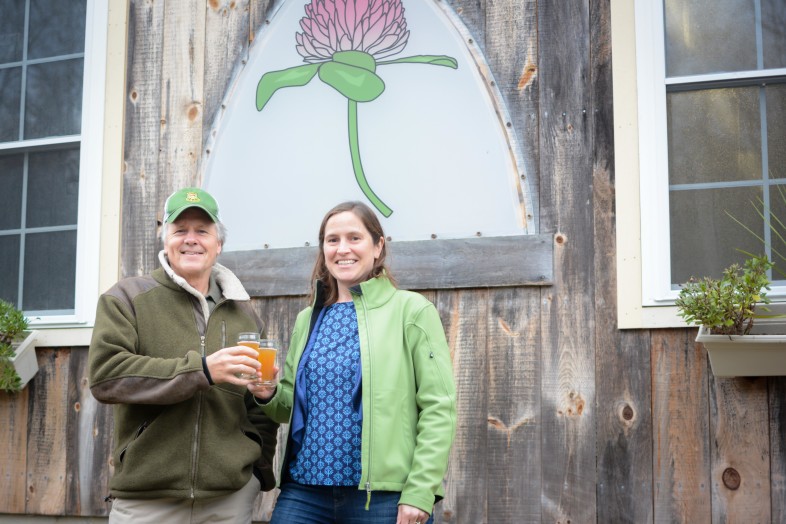 Wildlife biologist Doug Blodgett raises a glass of Timber Rattler IPA with Brocklebank Craft Brewery owner Anne Linehan at the Tunbridge brewery. A portion of the proceeds of the beer will be donated towards Blodgett’s work on the conservation of Vermont’s timber rattlesnake population.