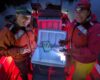 Kathy (left) and Dr. Kate Buckman (right) process fish samples on a boat.